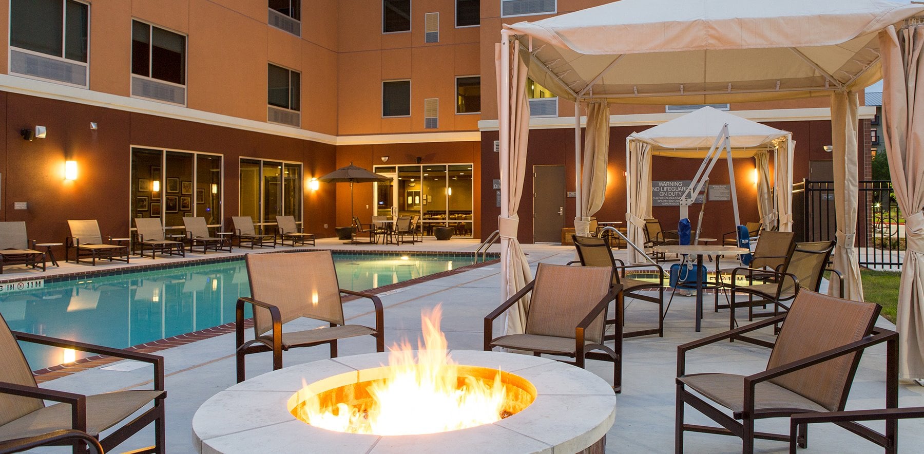 Poolside terrace and fire pit at Cambria Hotel Plano-Frisco